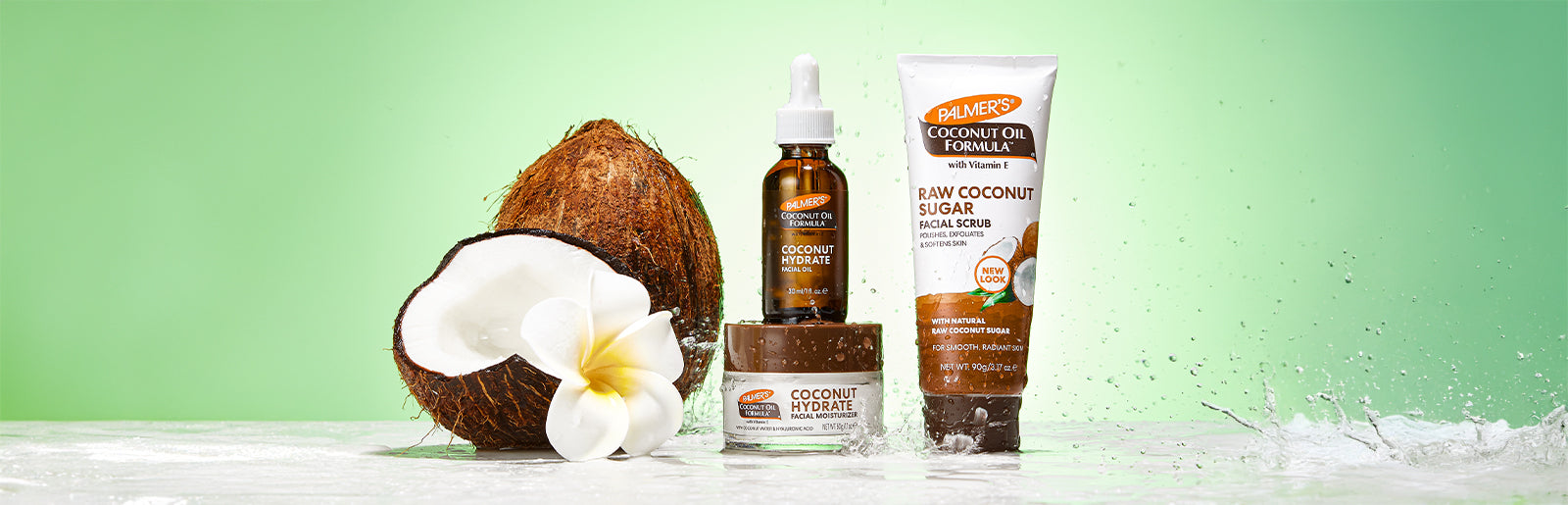 Palmer's Coconut Hydrate Facial Oil and Moisturizer under water splash next to coconut and monoi flower