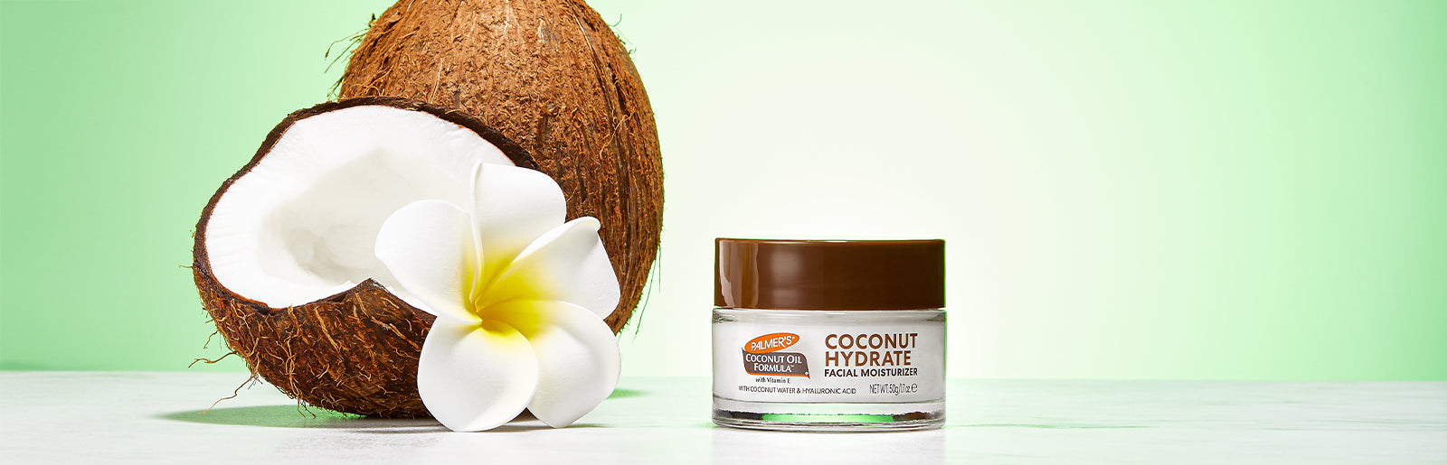 Palmer's Skin Therapy Face Oil on wooden background with ingredients around it