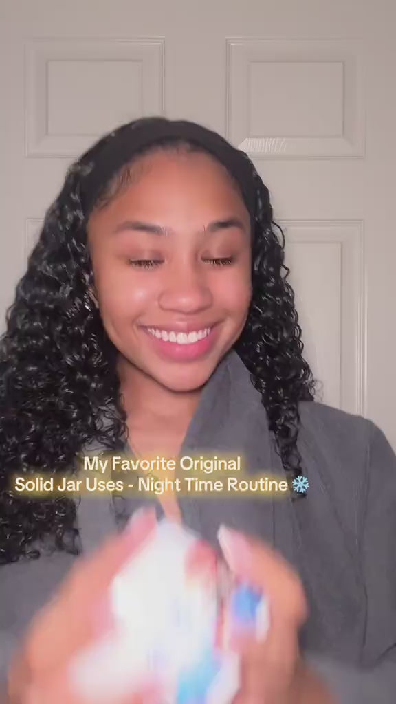 Woman showing her favorite uses of the Cocoa Butter Solid Jar