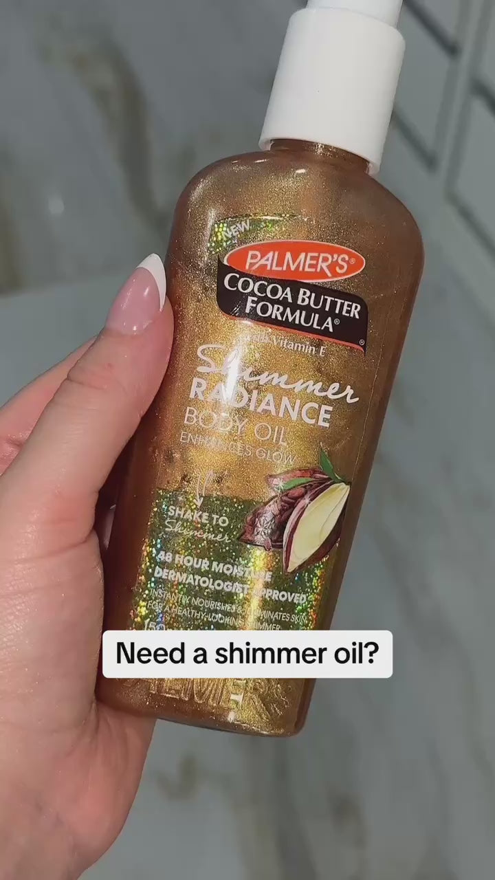 Woman using Palmer's Shimmer Radiance Body Oil